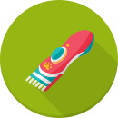 Illustration of a red and blue electric hair clipper on a green circular background, perfect for mobile dog grooming or any professional dog groomer.